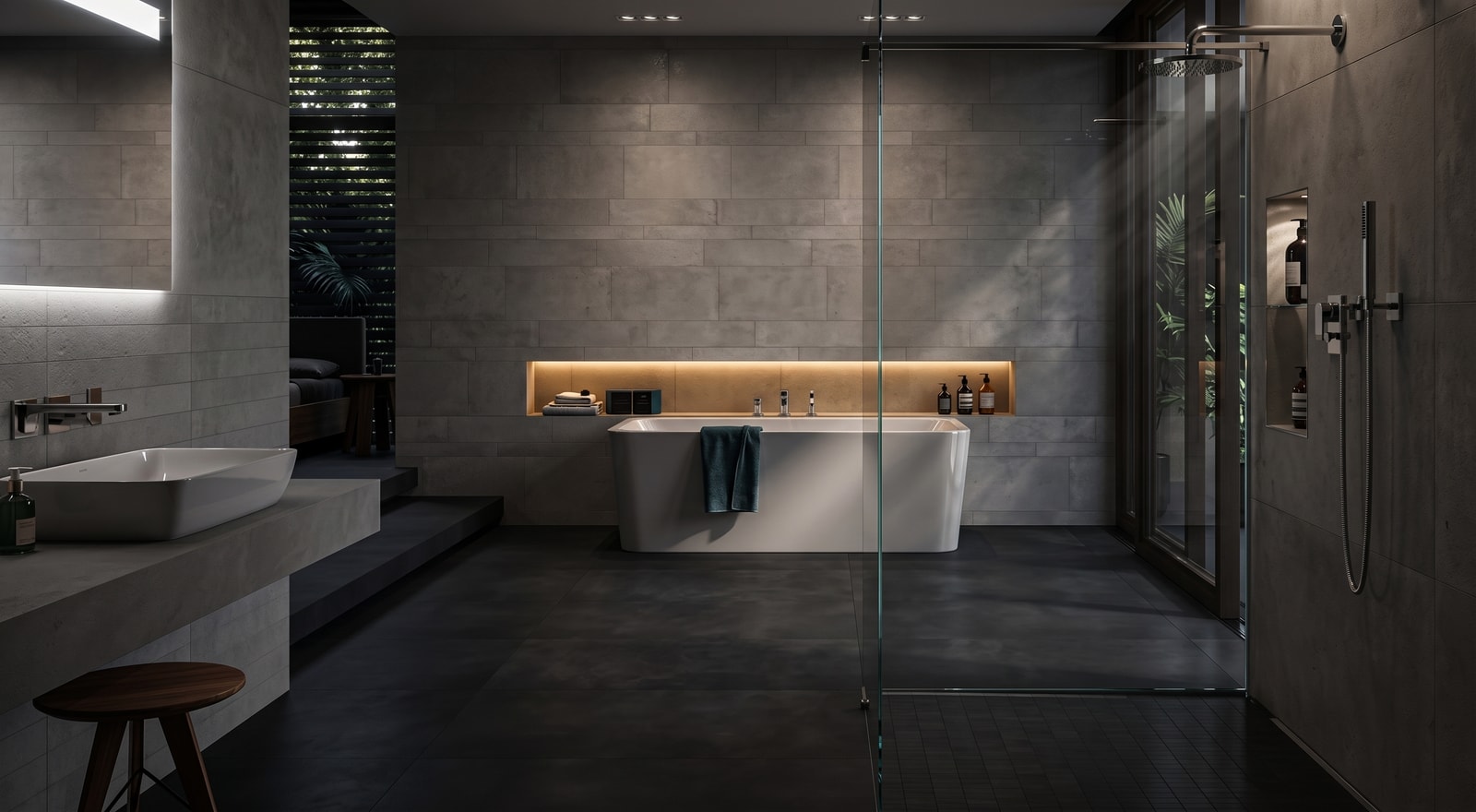 Ausstellungsbad bei SANPROFI: großformatige Fliesen in Betonoptik, freistehende Wanne, bodengleiche Dusche hinter Glas